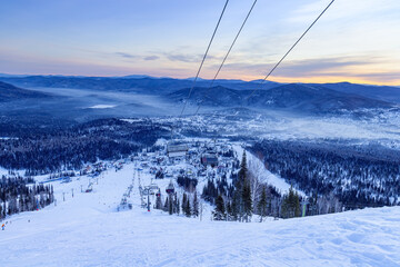 View from mount peak on Sheregesh ski resort and Altai mountains or Gornaya Shoria. Active winter...