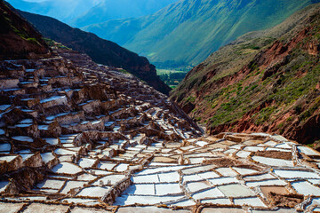 Landscape of the salt terraces of Maras ( Salineras de Maras) in the Andes mountain range in the region of Cusco, Peru, Sacred Valley
