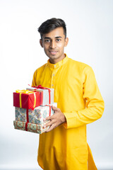 Man holding gift boxes during Diwali festival