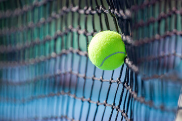 tennis ball hitting a tennis net