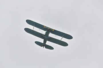 Small old airplane flying