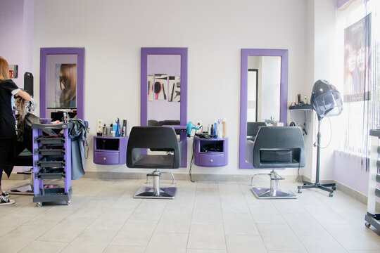Hairdresser dyeing a client's hair. Copy space.