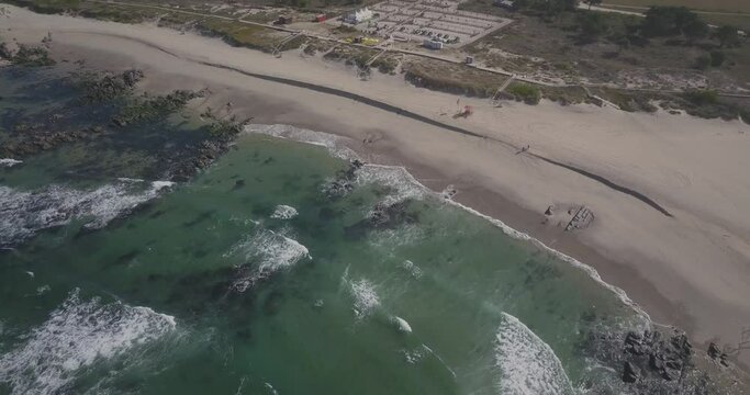 orbit view of afife waves in Viana do Castelo, Portugal. Amazing view of some and perfect waves crashing on the ocean. sunny day.