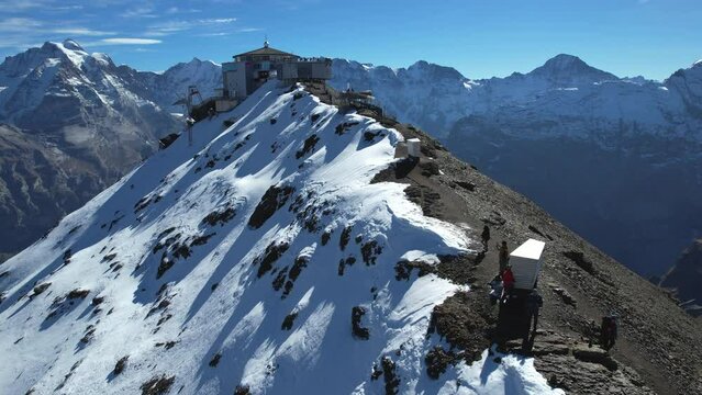 fantastic aerial shot approaching Schilthorn piz Gloria on a sunny autumn day. A James Bond movie was filmed here.
