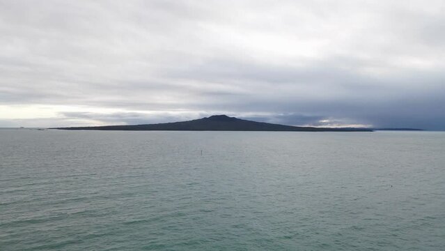 Slow aerial approach showing the beautiful Rangitoto Island Volcano