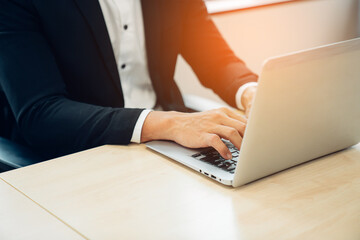 closeup hands of businessman working at office, Man typing keyboard on laptop or computer