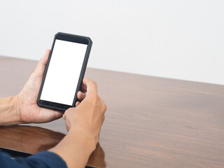 Closeup cellphone white screen blank in man hand on the table