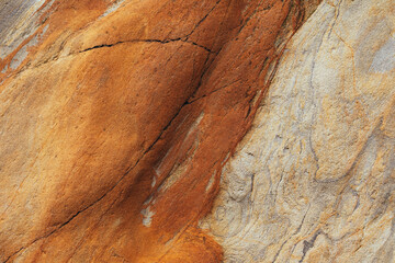 Natural rock texture of a colorful rock formations in silence beach (playa del Silencio) in Asturias, north of Spain.