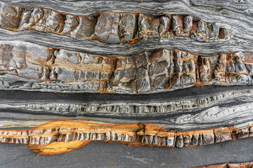 Natural rock texture of a colorful rock formations in silence beach (playa del Silencio) in Asturias, north of Spain.