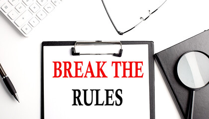 BREAK THE RULES text written on paper clipboard with office tools