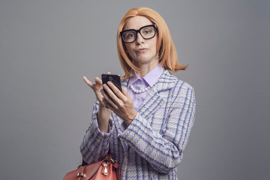Snobbish lady using her smartphone
