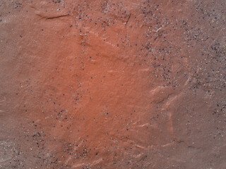 Vintage texture of a gradient brown stone surface in close-up. Macro photo of stone tile texture