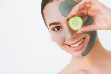 Female face with perfect skin and gray spa mask.