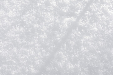 Background of fresh snow texture. Top view of the natural pure snow in winter with copy space