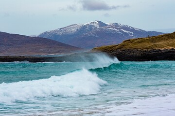 Beautiful shot of waves washing up the shore in Harris, Outer Hebrides