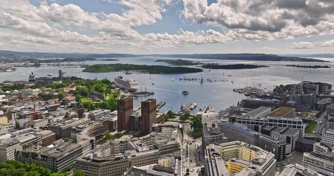Oslo Norway v1 cinematic drone flyover downtown capturing urban cityscape of sentrum central neighborhood capturing pipervika bay with fjord views on a sunny day - Shot with Mavic 3 Cine - June 2022