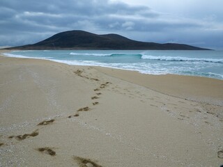 Beautiful shot of footsteps on a sandy beach in Harris, Outer Hebrides