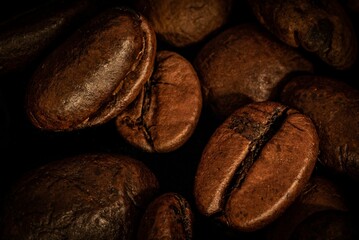 Closeup shot of a pile of rich brown coffee beans