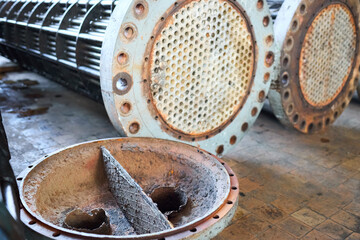 Corrosion, refinery heat exchangers chiller tubes with flange system. Row of Industrial heat...