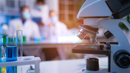 Laboratory research, microscope with lab glassware, science laboratory research and development concept.