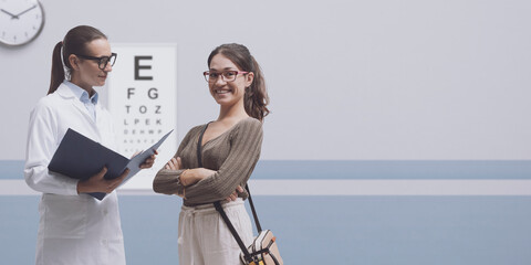 Young woman talking with her optometrist