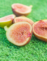 Ripe figs on a green background