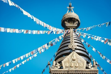 Closeup shot of the Swayambhu ancient religious complex atop a hill in the Kathmandu Valley