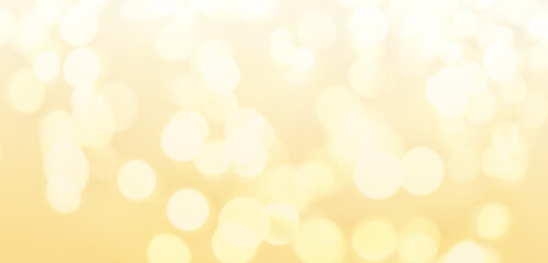 Christmas golden lights Background. Abstract twinkled bright bokeh defocused wallpaper.