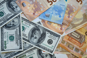 Fototapeta na wymiar Background of different euro and dollar banknotes. Financial and business banner 