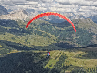 paragliding flying on dolomites panorama