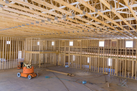 Forklift Boom Truck Was Used By Contractor To Lift The Framing Beams Of Home That Was Under Construction.