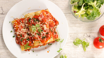 canneloni with beef and tomato sauce