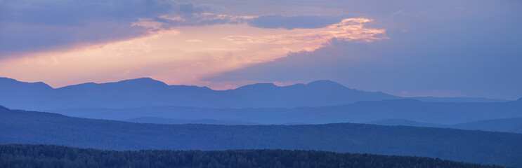 Sunset sky in the mountains, panoramic view