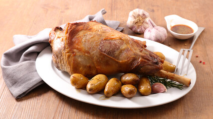 Roast leg of lamb with potatoes and sauce
