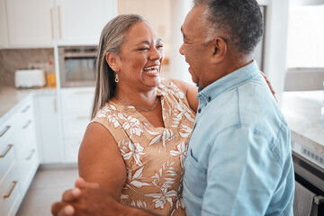 Senior couple dance in kitchen with celebration for retirement, real estate or happy marriage....