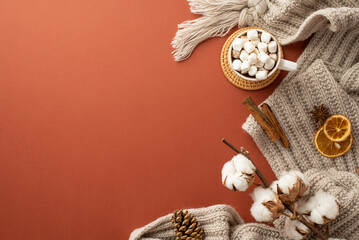 Top view photo of knitted scarf mug of hot drinking with marshmallow on rattan placemat dried...