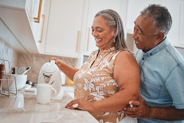 Fototapeta na wymiar Tea, couple and retirement with a man and woman using a kettle in the kitchen of their home together. Love, morning and romance with a senior male and woman making a coffee beverage in their house