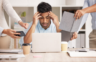Headache, busy and businessman with stress from work, employees and burnout from planning in an office. Tired manager, ceo or boss with anxiety while working with a team on a laptop at a company