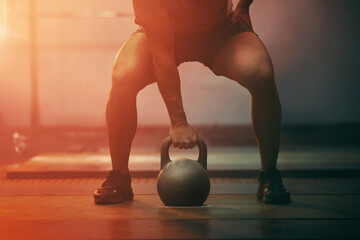 Fitness, gym and sports training with kettlebell of athlete in exercise, workout and motivation...