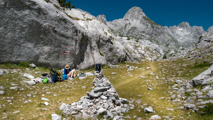 mountain view of the peaks of the Balkan. high mountains, blue skys. person in the middle
