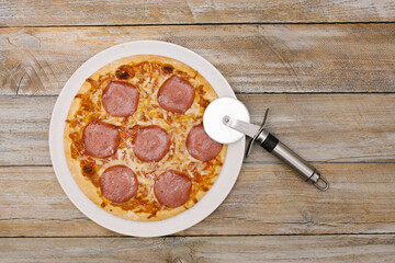 Pizza pieces series as illustration of division in maths on wood table