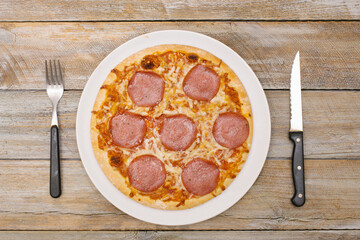 Full, one - Pizza pieces series as illustration of division in maths on wood table