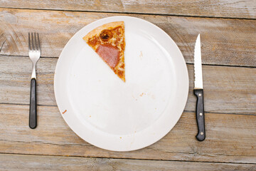 One eighth - Pizza pieces series as illustration of division in maths on wood table