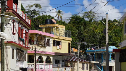 Fototapeta na wymiar buildings on the hillside of the city Santa Barbara de Samana in the province of the Samana Peninsula in the Dominican Republic in the month of January 2022