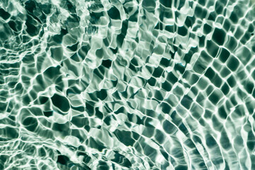 Rippled transparent fresh blue green water gel surface in swimming pool with flecks, waves, shade. Healthy relaxation in sunny summer. Vacation spa coast sea, natural concept. Flat lay. Place for text