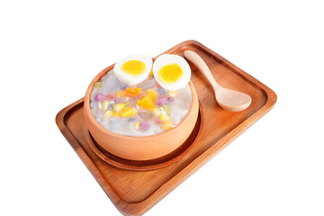 Thai desserts with coconut milk and small rolls and cooked eggs