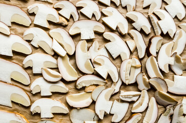 Boletus edulis, penny bun, cep, porcino or porcini mushroom, top view of sliced edible mushrooms in the kitchen