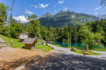 Obraz premium View of Blausee (The Blue lake) in Bernese Oberland, famous tourist destination in Switzerland