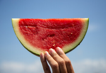 Fresh watermelon slice with sky