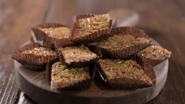 Desserts with almonds, peanuts and seeds in caramel. Traditional Sardinian sweet. Sweet squares. Almond Gateau, sarda Food, for smartphones and social networks